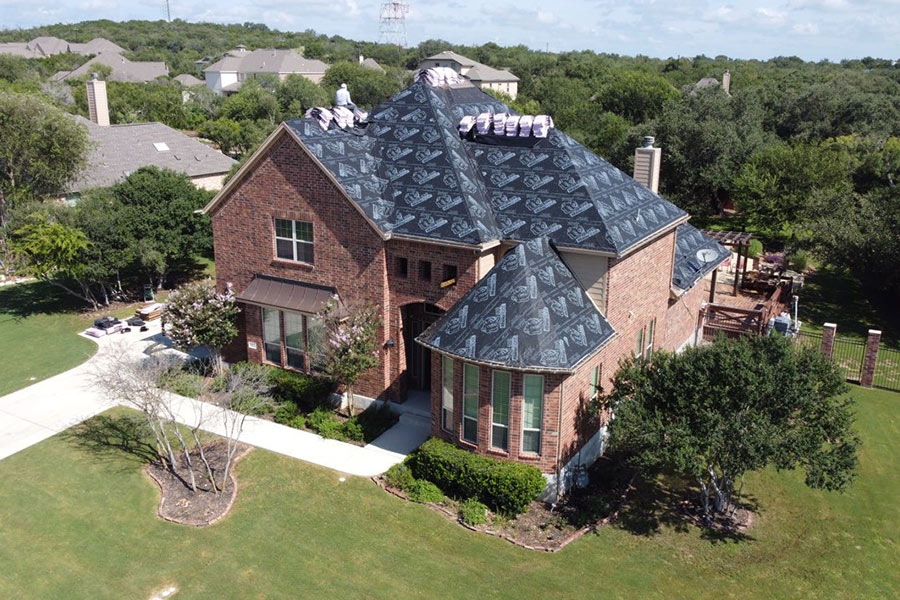 aerial view of residential property with roofing replacement in process converse-tx