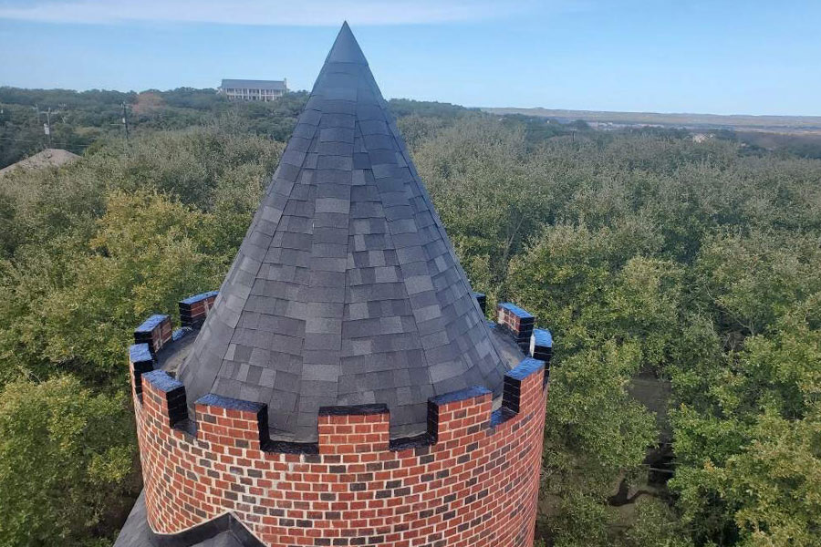 castle roof close up with new asphalt shingles roof replacement converse-tx